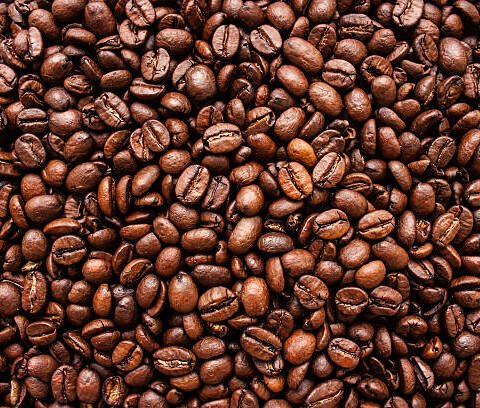 Dark Roasted coffee beans Robusta with a bold, textured appearance